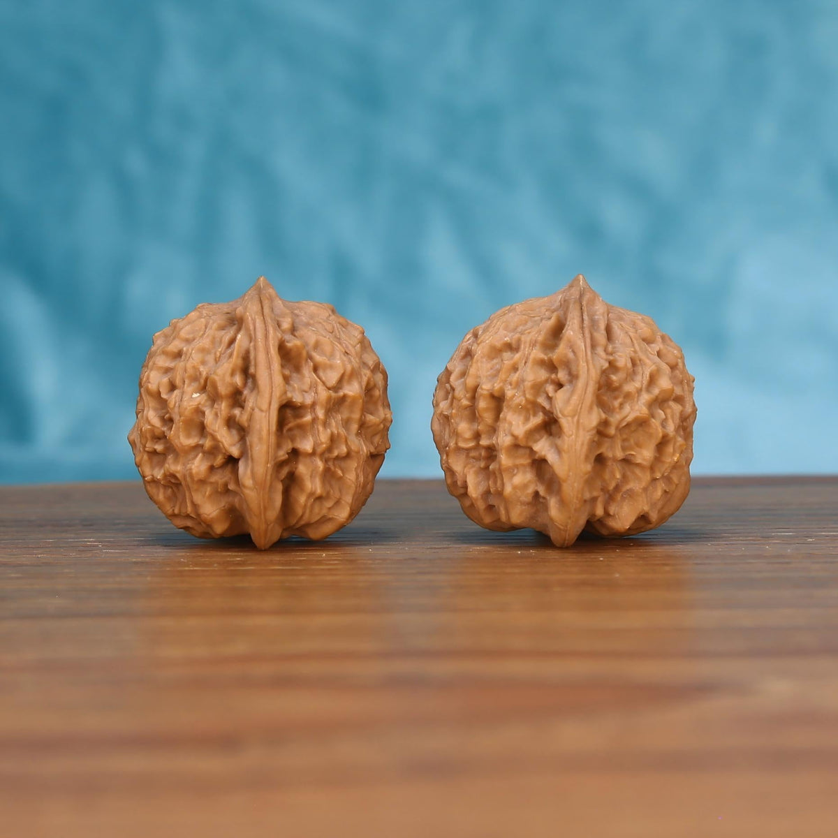 Hong-Dou wenwan walnut pair alternate angle, blue background – symmetrical tectonic ridge pattern