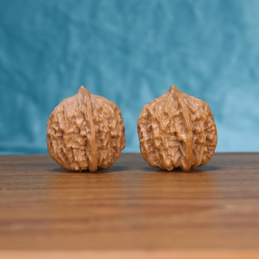  Jiang-Jun-Bang wenwan walnut pair alternate angle, blue background – symmetrical general's armor ridge pattern