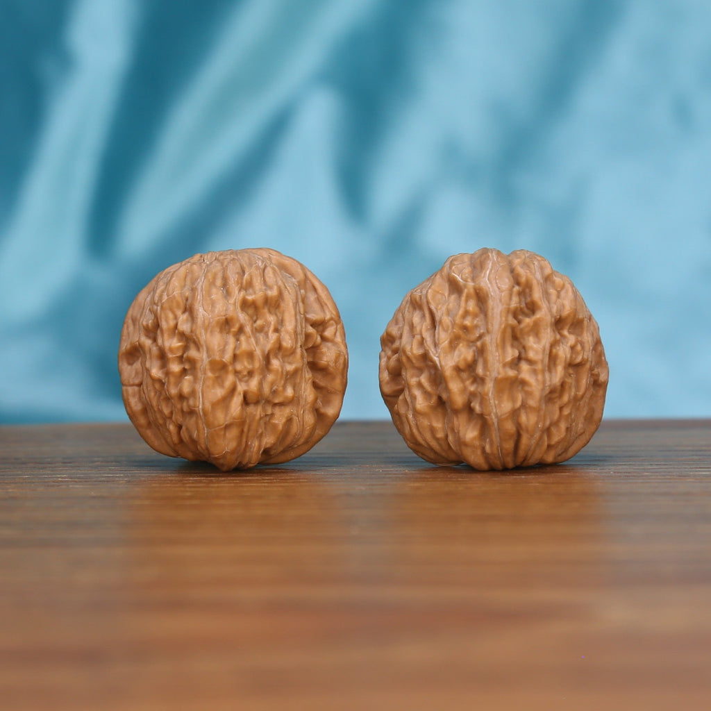 Ju-Bao-Pan walnut duo on wooden surface – under 30mm height pocket sanctuary EDC by mistbodhi
