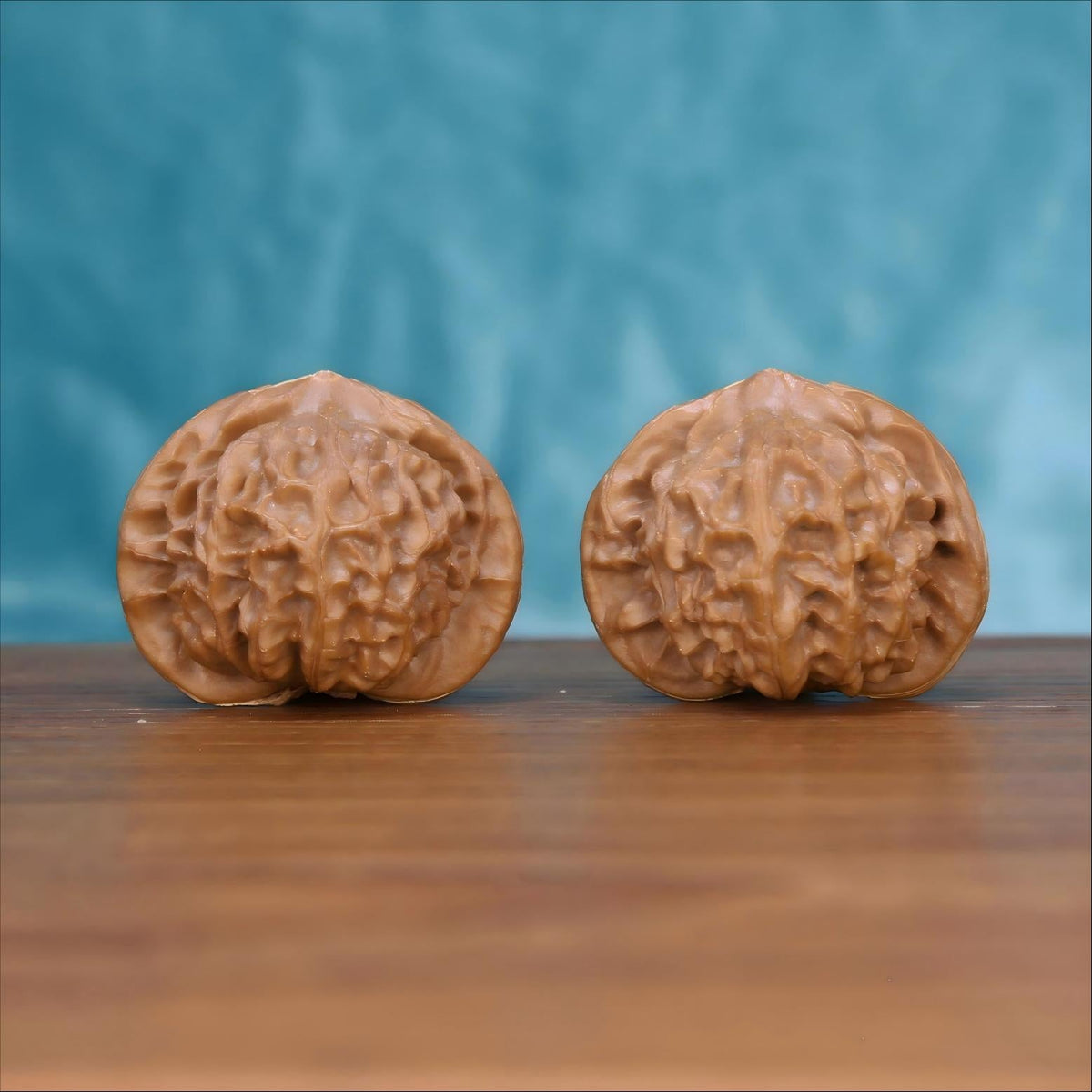 Gong-Deng walnut set side profile on wood, blue background – architectural lantern grain detail