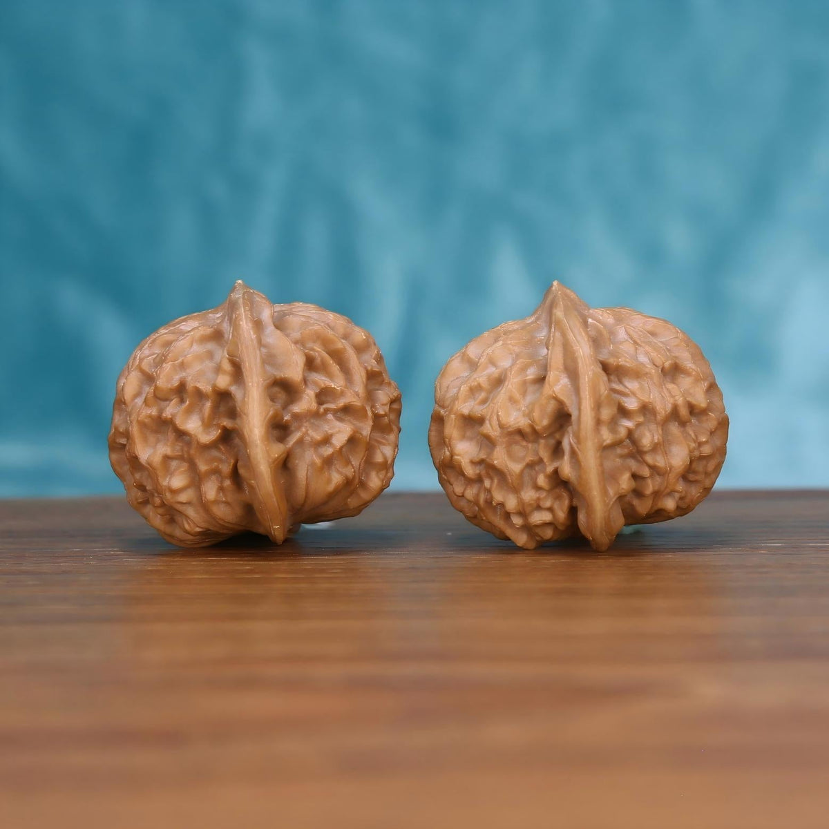  Gong-Deng wenwan walnut pair alternate angle, blue background – symmetrical architect's pavilion ridge pattern