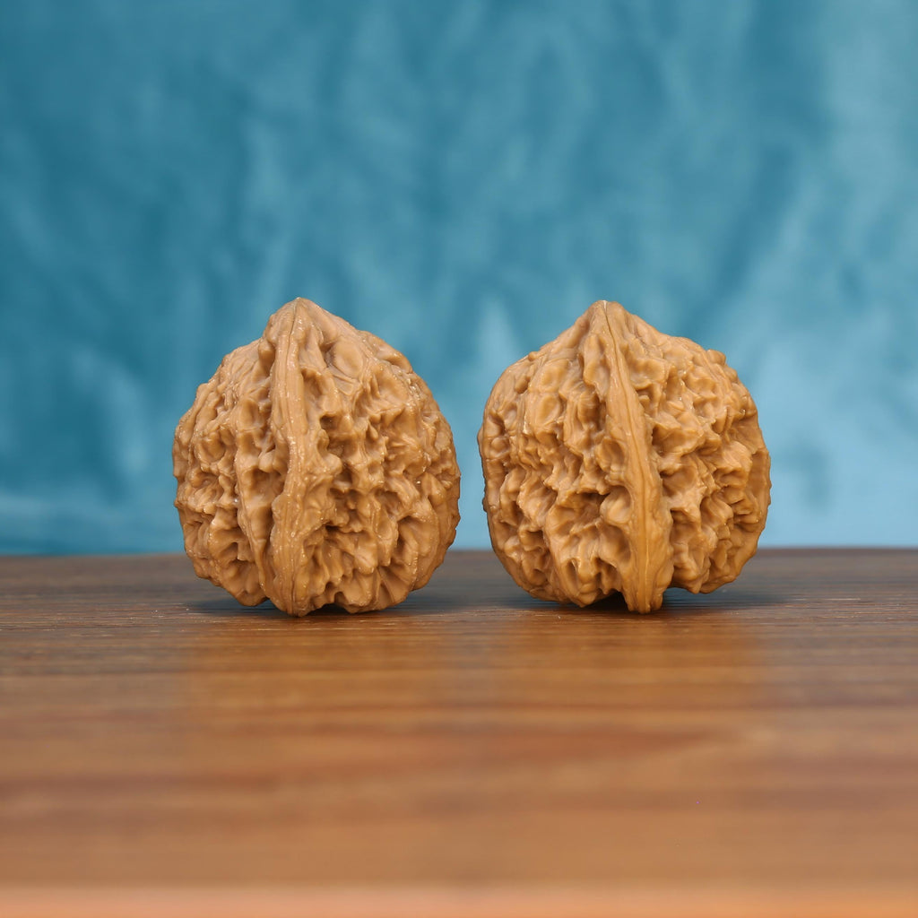 Nan-Jiang-Shi wenwan walnut pair alternate angle, blue background – symmetrical ancient bedrock ridge pattern