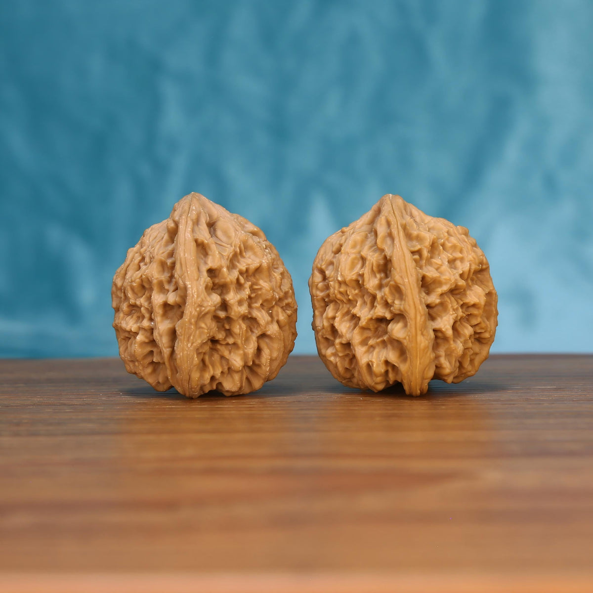 Nan-Jiang-Shi wenwan walnut pair alternate angle, blue background – symmetrical ancient bedrock ridge pattern