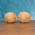 Two Nan-Gua-Dun wenwan walnuts on wooden surface, blue fabric background – matching earthbound bastion set
