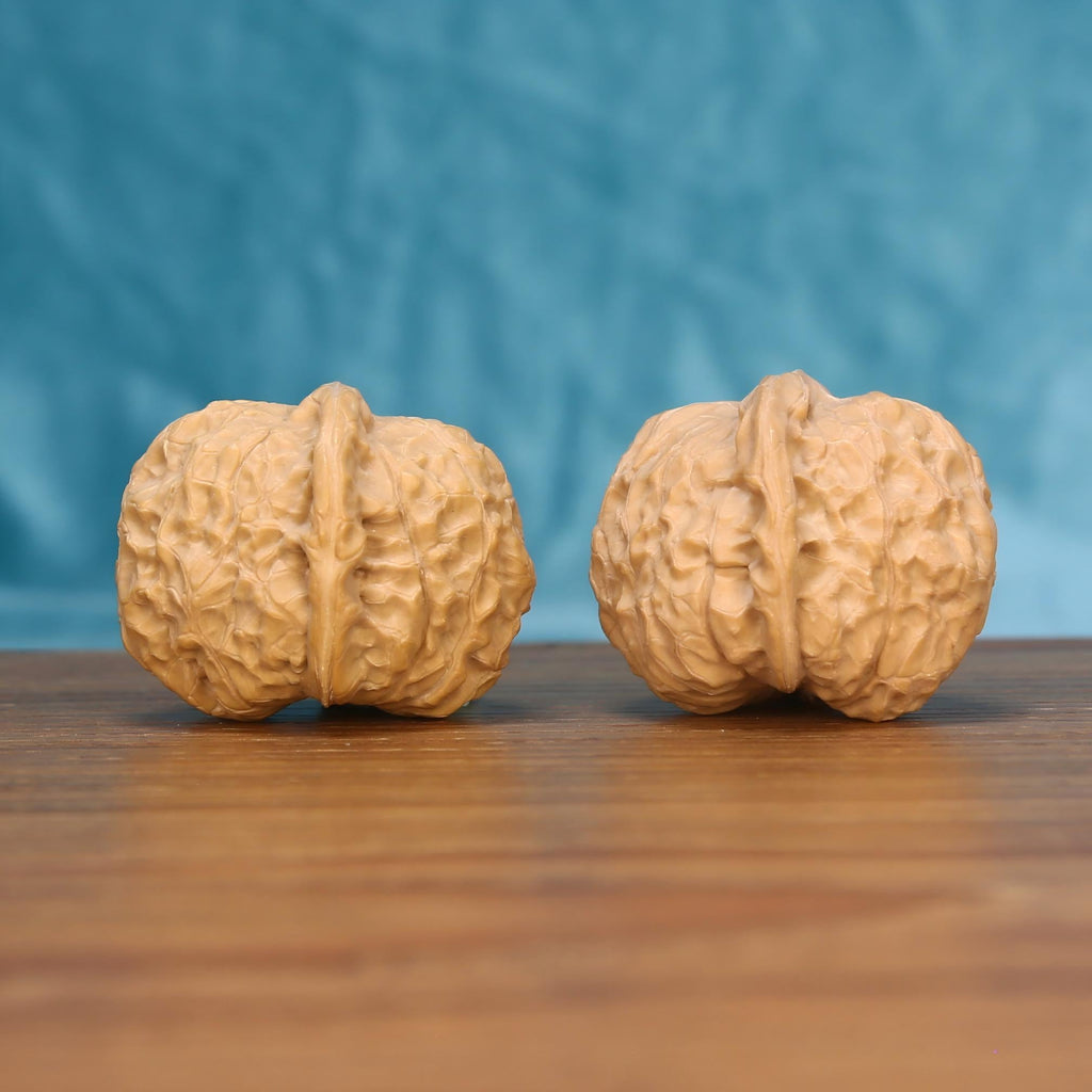  Nan-Gua-Dun wenwan walnut pair alternate angle, blue background – symmetrical earthbound bastion ridge pattern