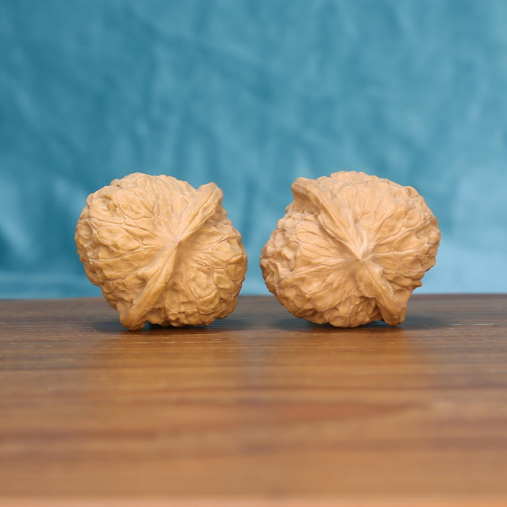  Single Nan-Gua-Dun wenwan walnut bottom view on wooden surface – natural base and pumpkin-shaped texture detail