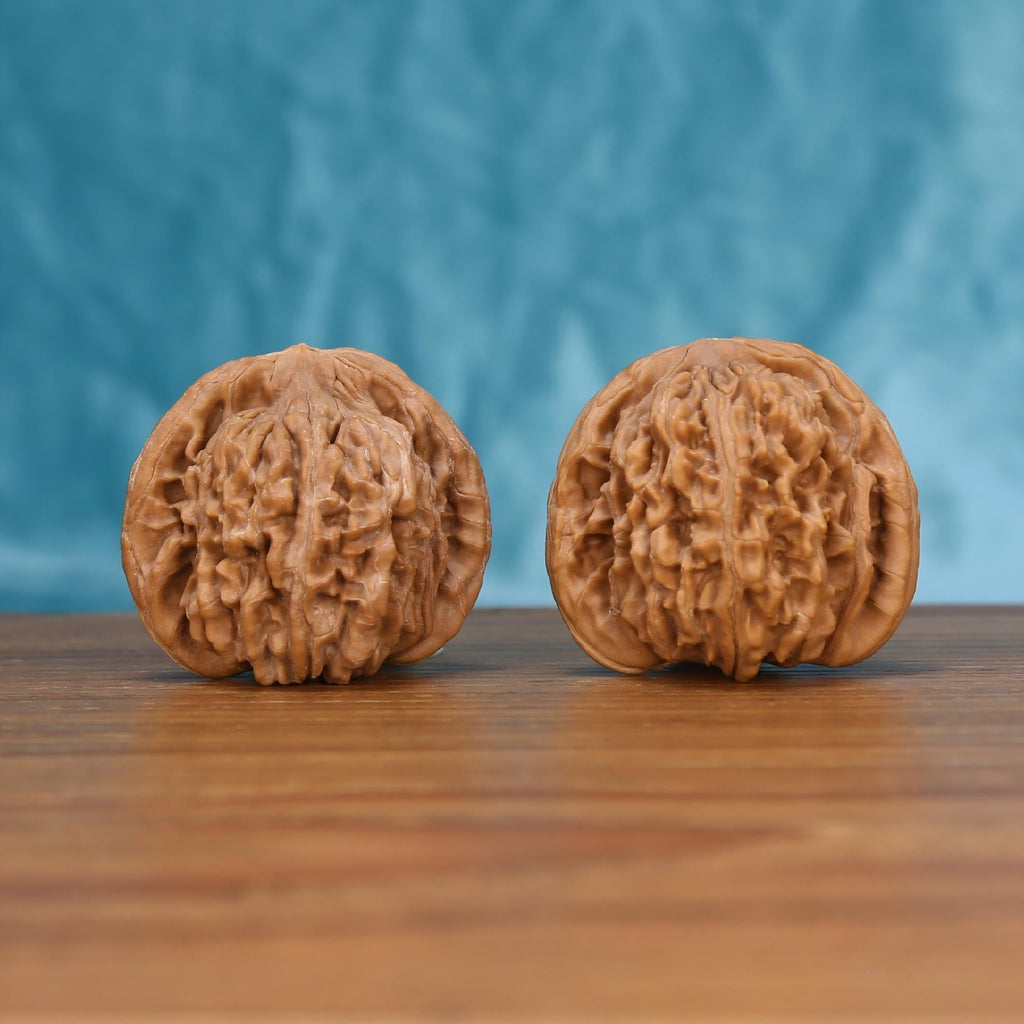 Si-Zuo-Lou walnut set side profile on wood, blue background – sovereign pavilion tower grain detail